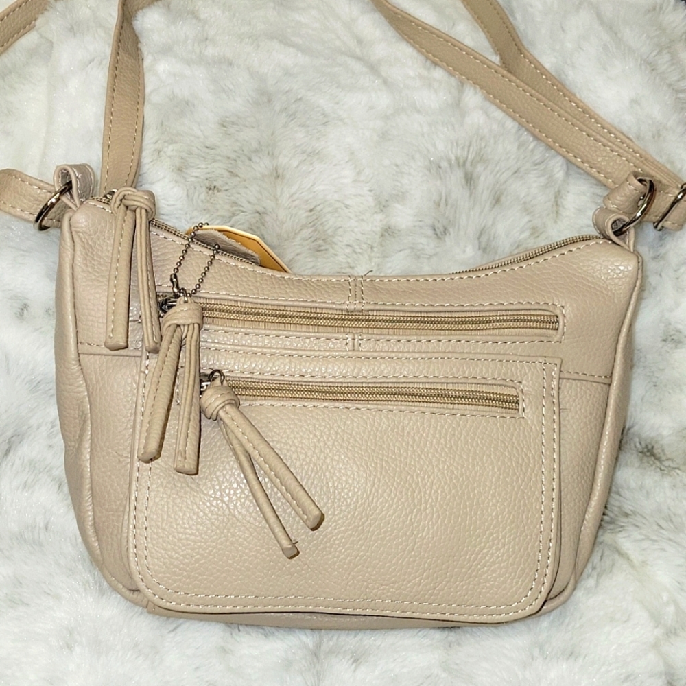 Cream color cowhide leather small crossbody purse .